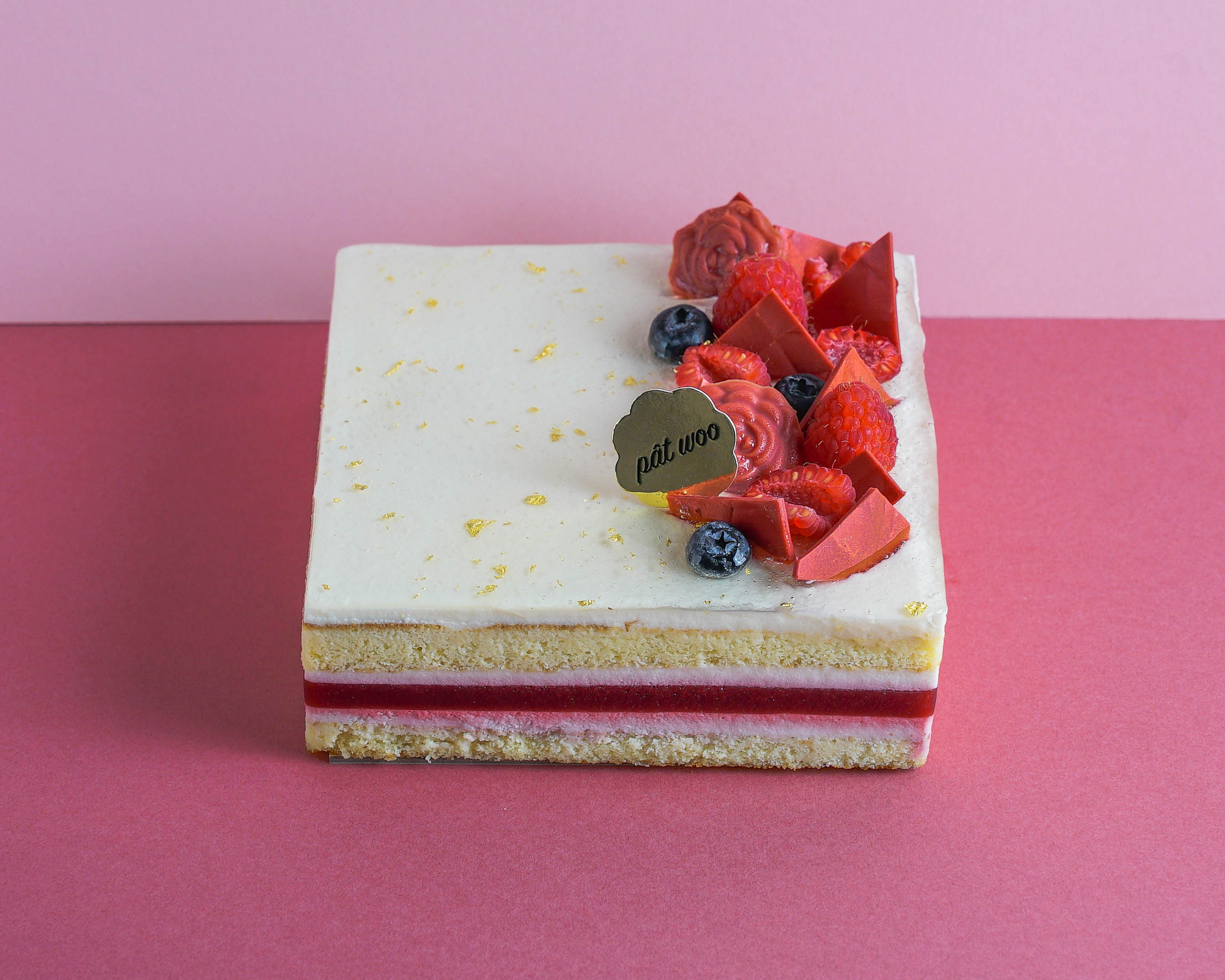 A delicate tri-flavoured layered cake decorated with raspberries and chocolate pieces. The tanginess of the raspberry jelly balances the sweeter rose-scented almond sponge cake and the fruity scent of the lychee mousse. A favourite among those with a sweet tooth!